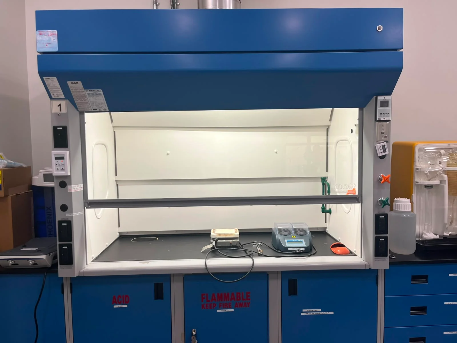 Chemical fume hood with airflow test instruments inside the work area