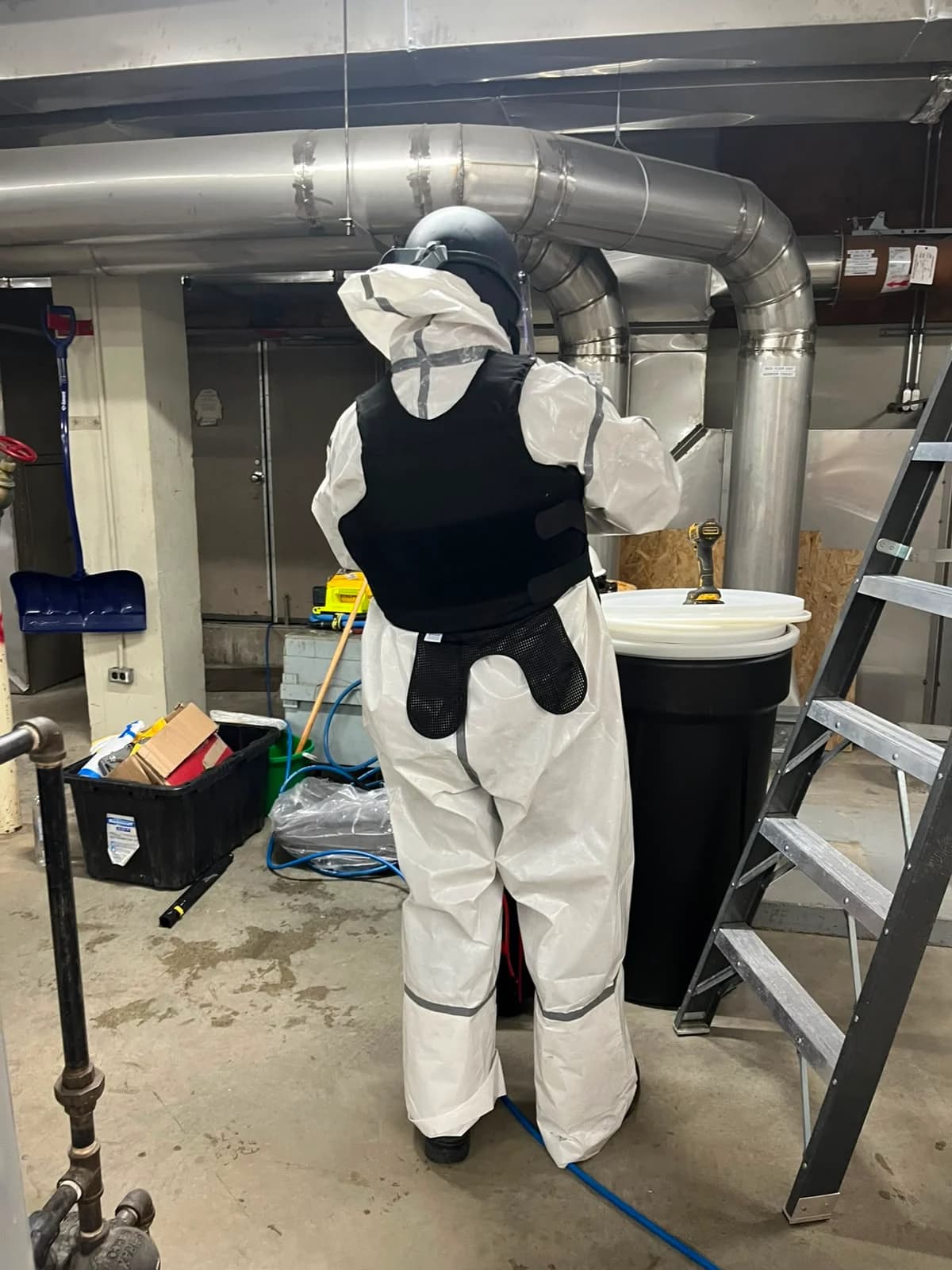 Laboratory service technician assessing equipment