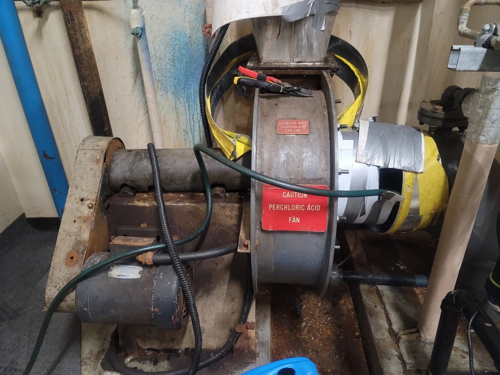 Laboratory exhaust fan with a perchloric acid warning label